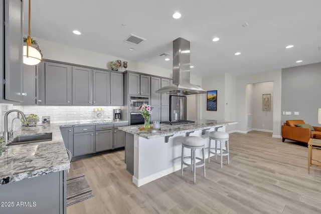 a bathroom with a double vanity sink mirror and shower