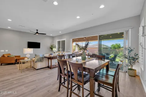 a kitchen with granite countertop a stove a sink and a refrigerator
