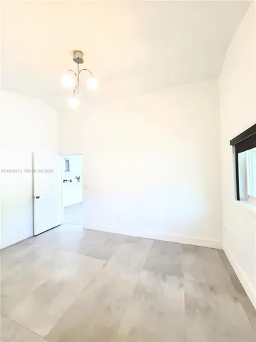 a bathroom with a toilet sink and shower