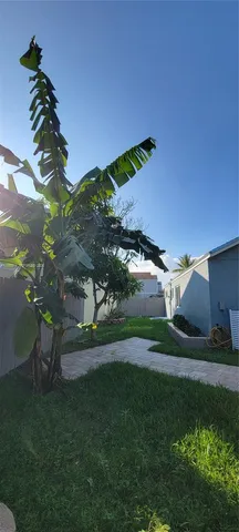 a view of a backyard with a house