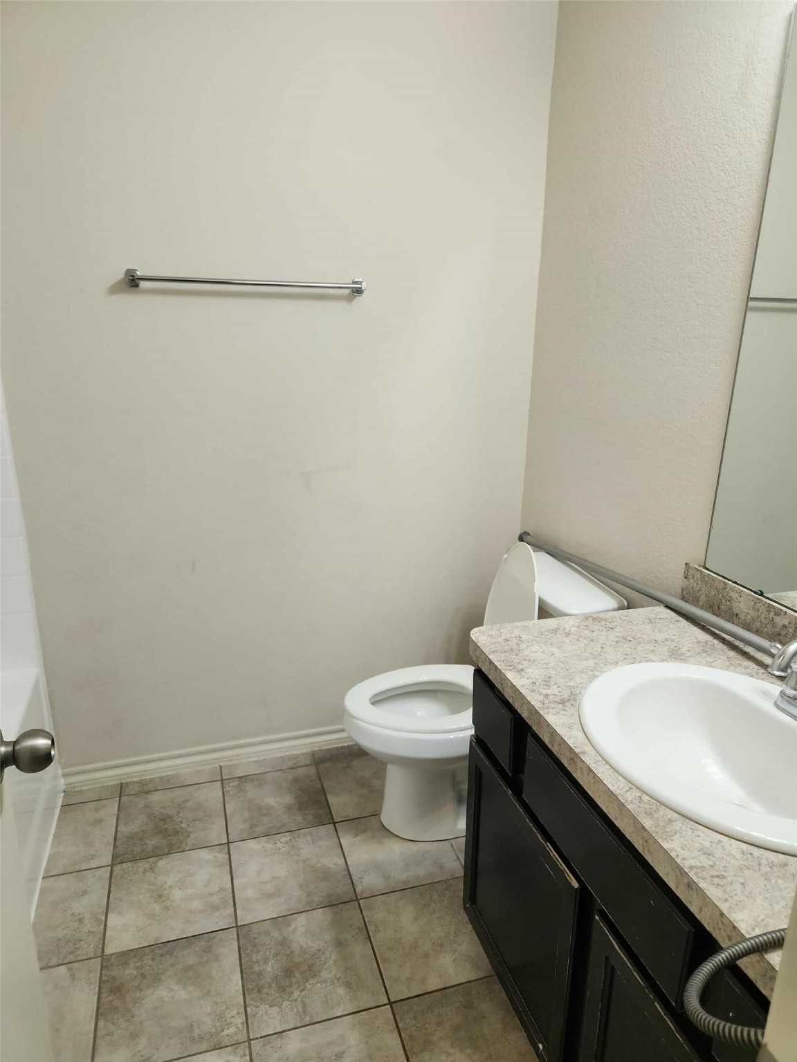 803 Lovebug Lane Conroe, TX 77301 - Photo 12 of 12 a bathroom with a granite countertop sink and a toilet
