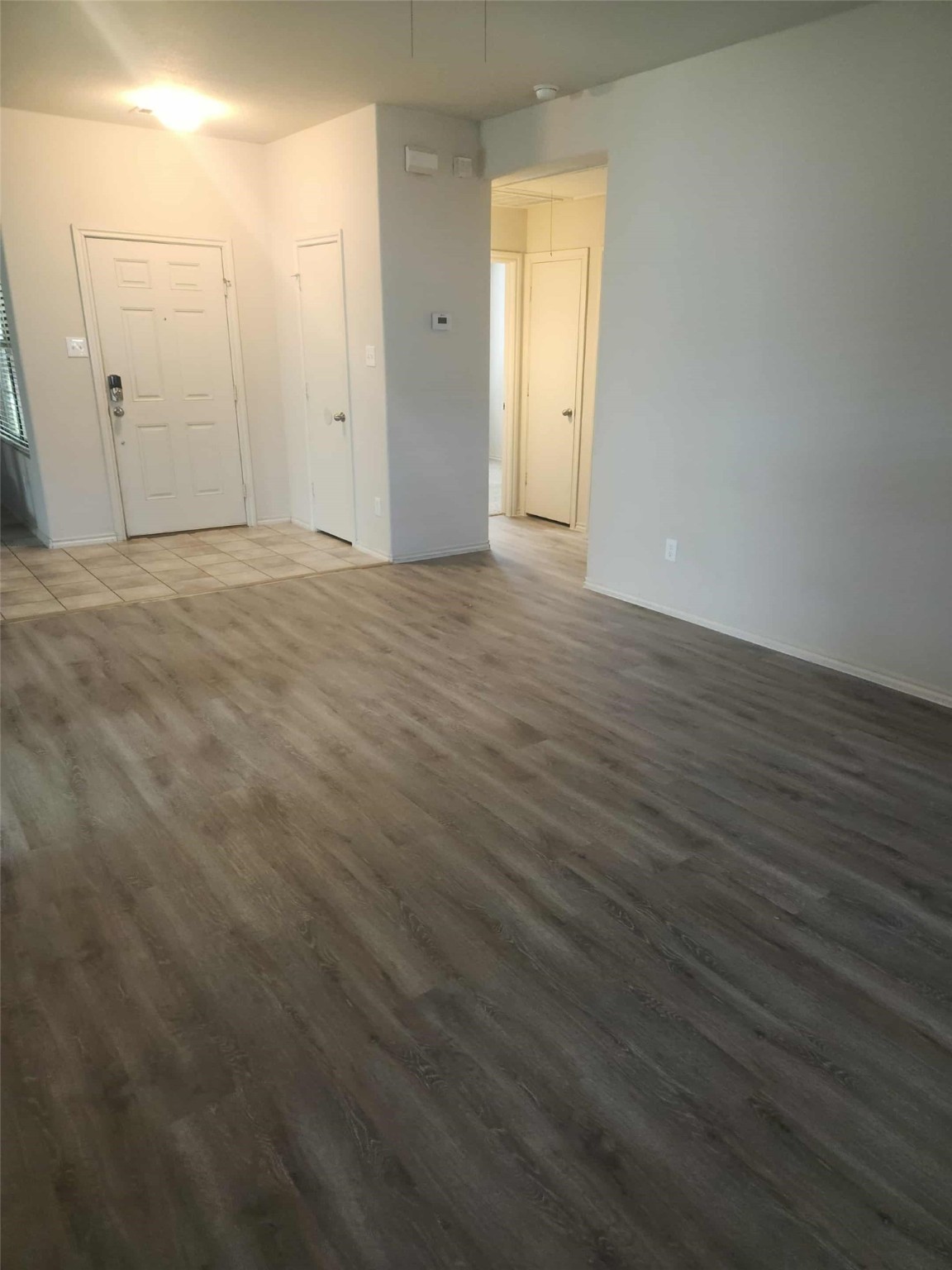 803 Lovebug Lane Conroe, TX 77301 - Photo 2 of 12 a view of an empty room and wooden floor
