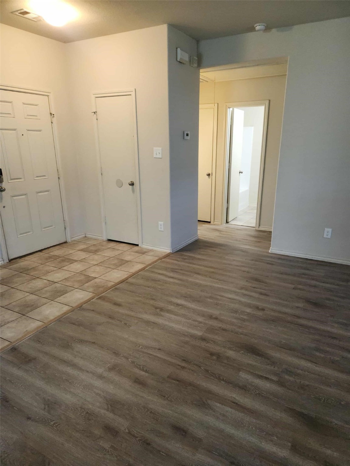 803 Lovebug Lane Conroe, TX 77301 - Photo 3 of 12 a view of an empty room with wooden floor