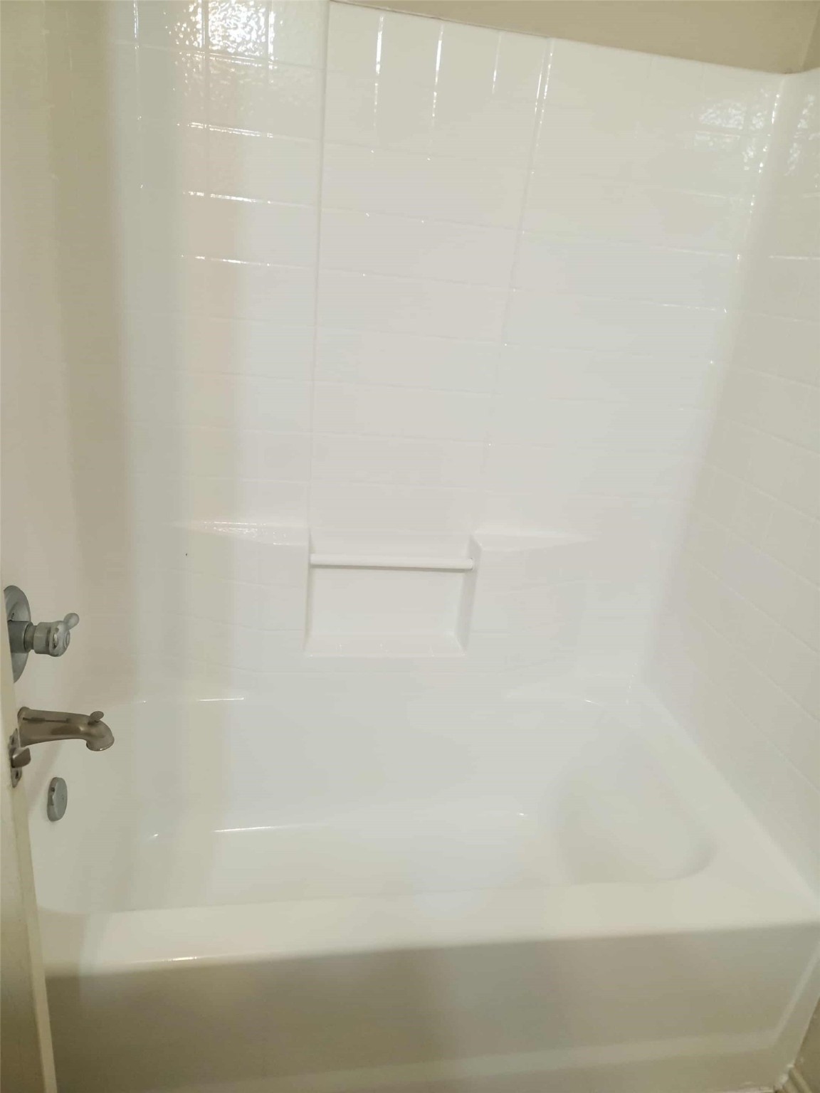 803 Lovebug Lane Conroe, TX 77301 - Photo 10 of 12 a bathroom with a bathtub