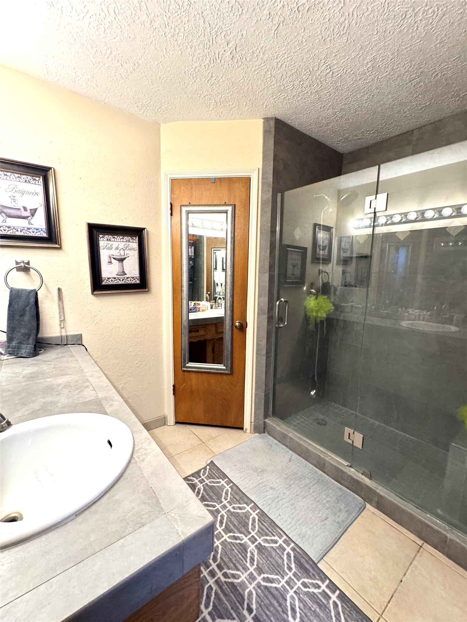 254 Evanston Street Houston, TX 77015 - Photo 16 of 22 a bathroom with a sink and shower