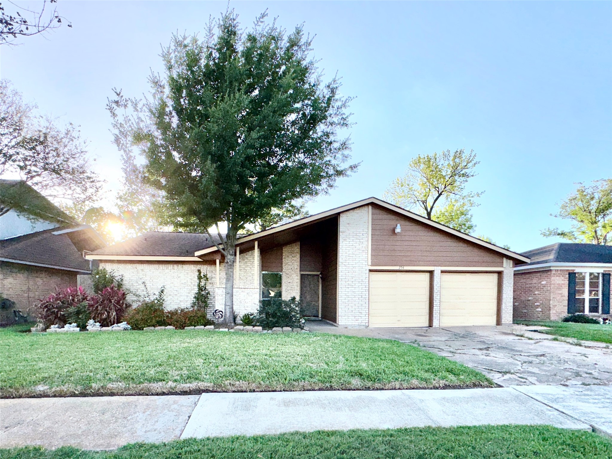 254 Evanston Street Houston, TX 77015 - Photo 2 of 22 a front view of a house with garden
