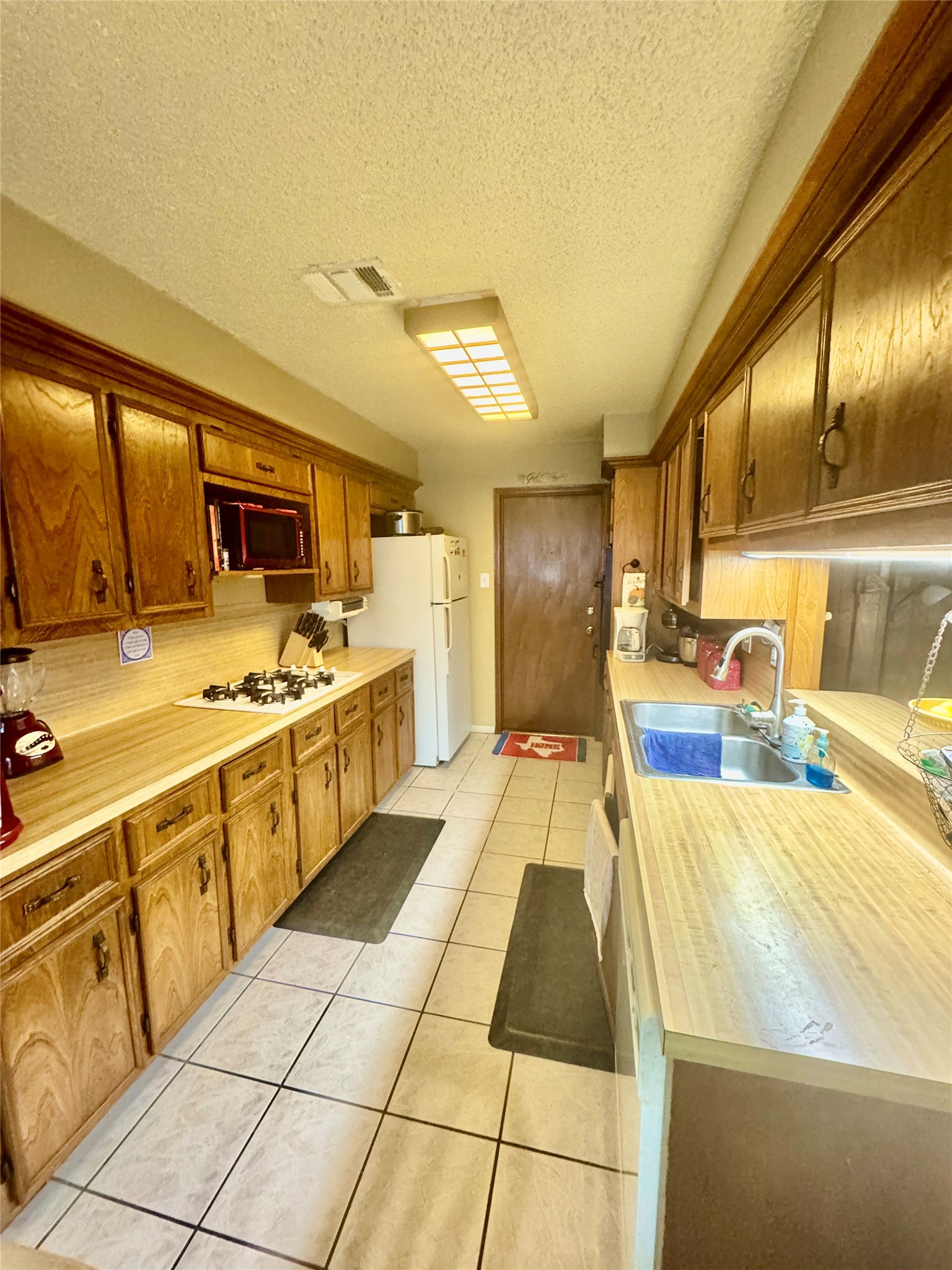 254 Evanston Street Houston, TX 77015 - Photo 8 of 22 a large kitchen with cabinets