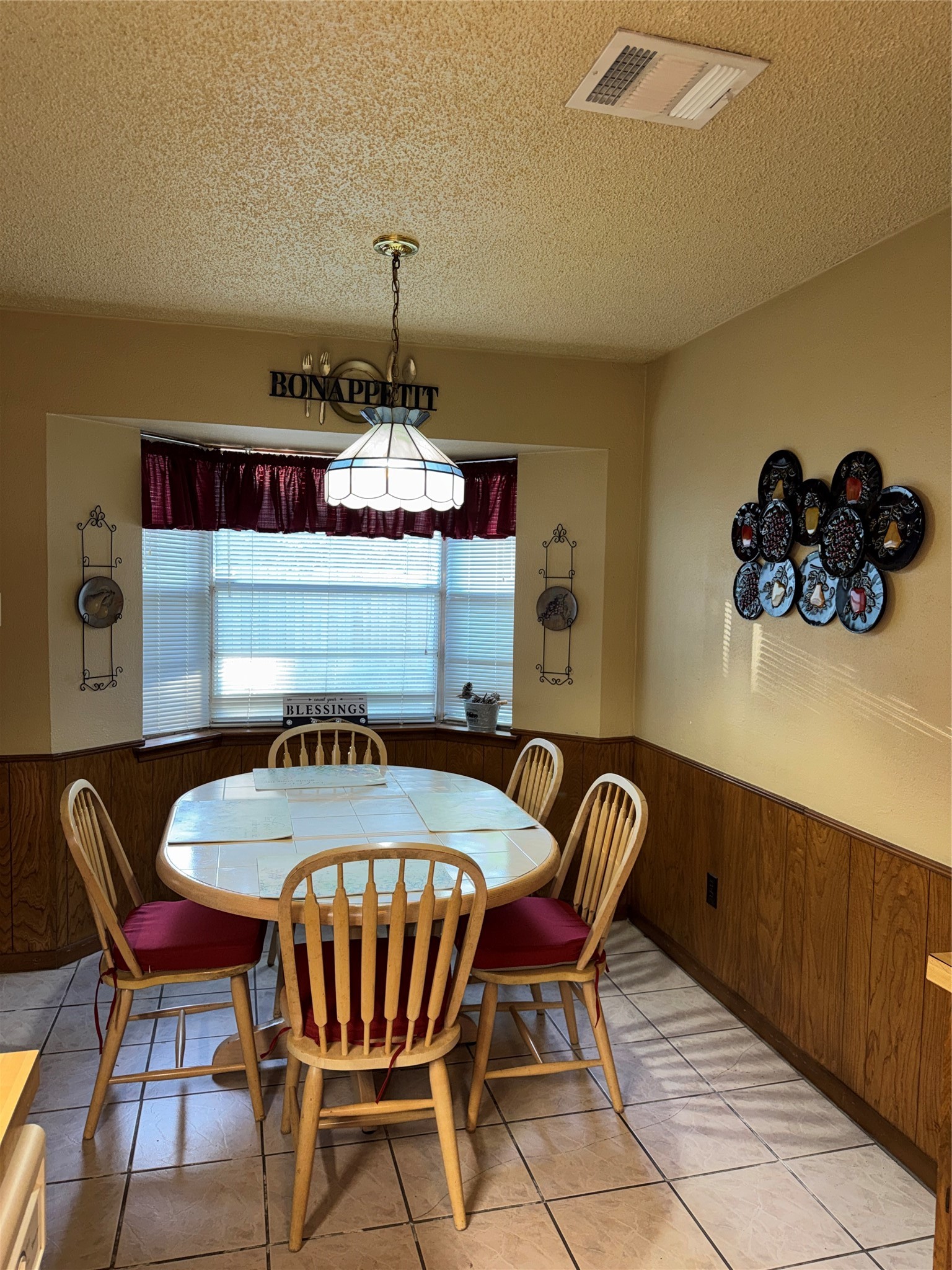 254 Evanston Street Houston, TX 77015 - Photo 9 of 22 a view of a dining room with furniture and chandelier