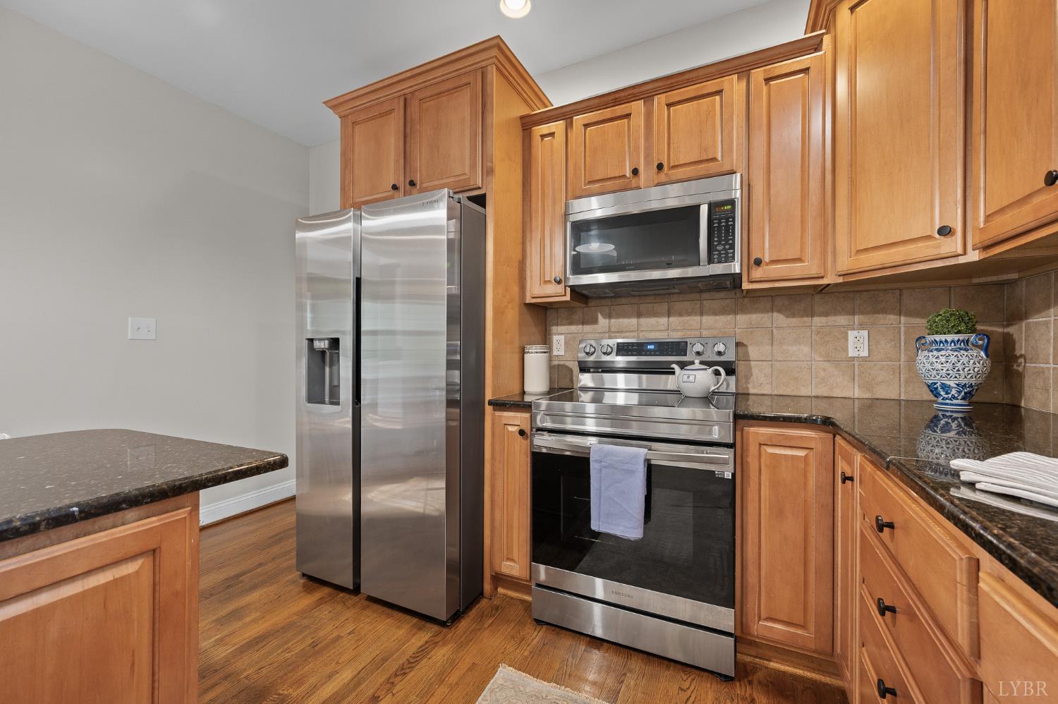 1089 Howards Scenic Trail Forest, VA 24551 - Photo 18 of 96 a kitchen with stainless steel appliances granite countertop a refrigerator stove and sink