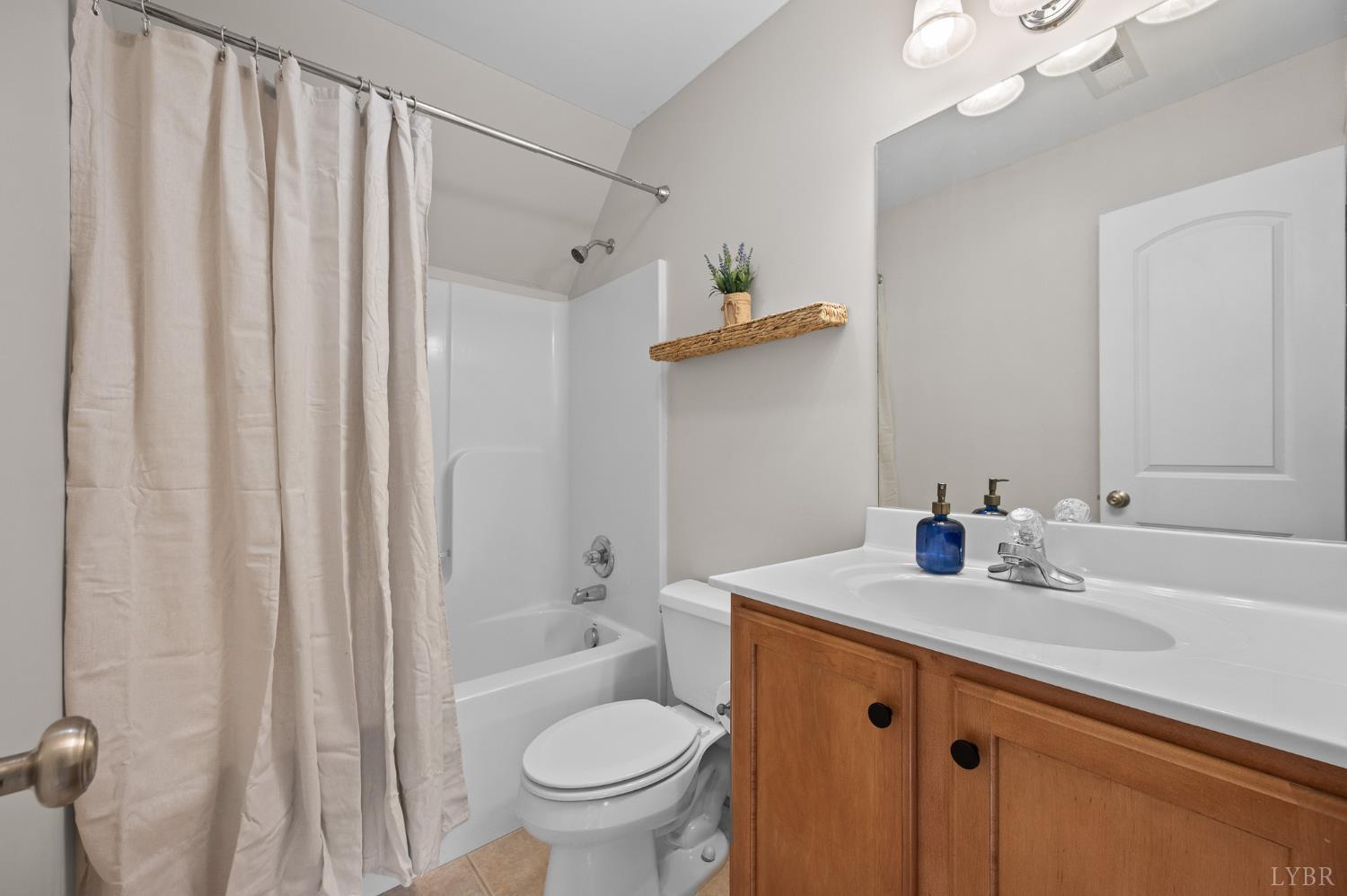 1089 Howards Scenic Trail Forest, VA 24551 - Photo 41 of 96 a bathroom with a granite countertop sink toilet and shower