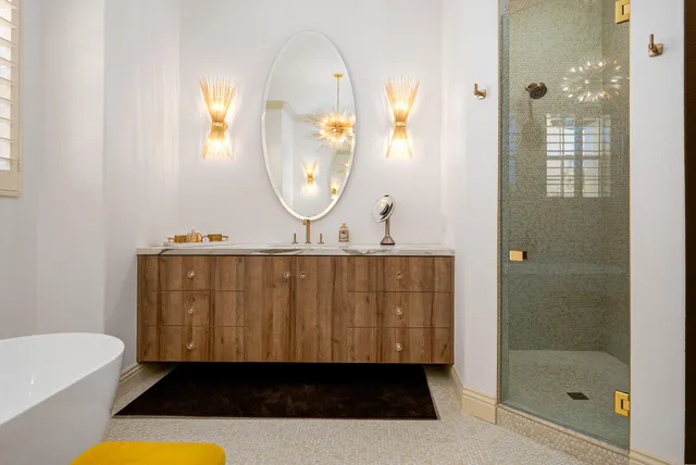 a bathroom with a sink vanity mirror and toilet