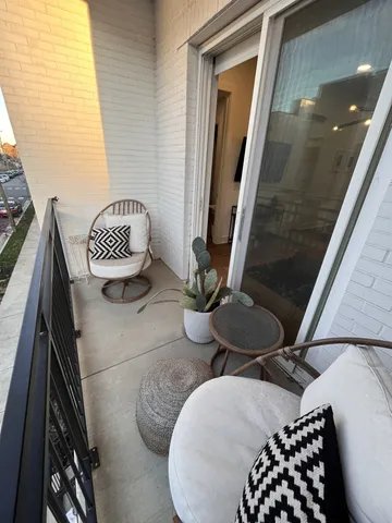 a bathroom with a toilet and a mirror