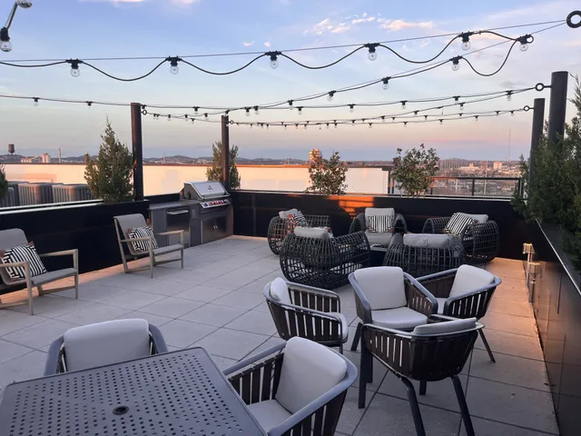 a dining room with furniture and wooden floor