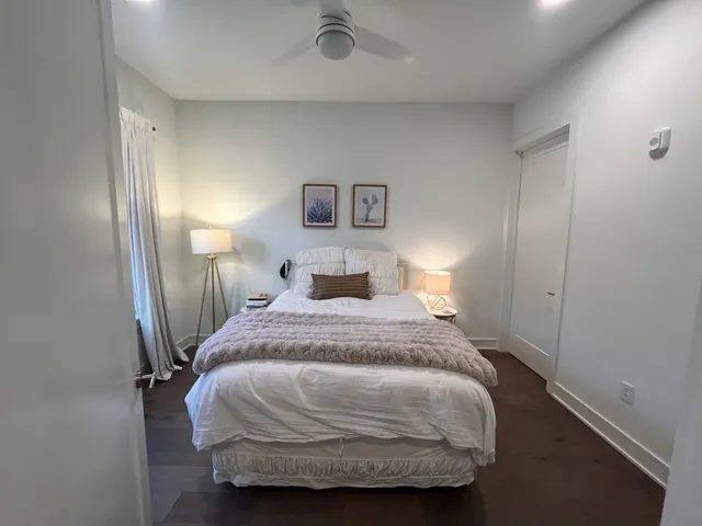 a bedroom with a bed and a night stand