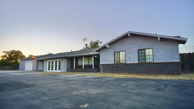 a house with trees in the background