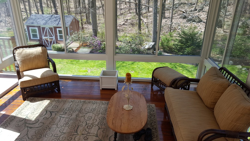 15 Stage Coach Road Boxford, MA 01921 - Photo 12 of 29 a view of a patio with couches chairs and a potted plant