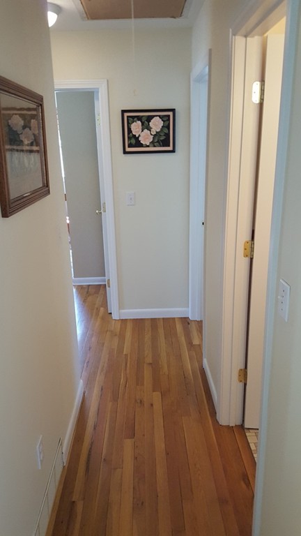 15 Stage Coach Road Boxford, MA 01921 - Photo 15 of 29 a view of a hallway with wooden floor