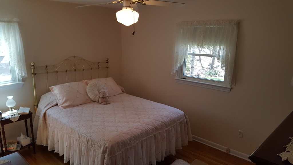 15 Stage Coach Road Boxford, MA 01921 - Photo 17 of 29 a bed sitting in a bedroom next to a window