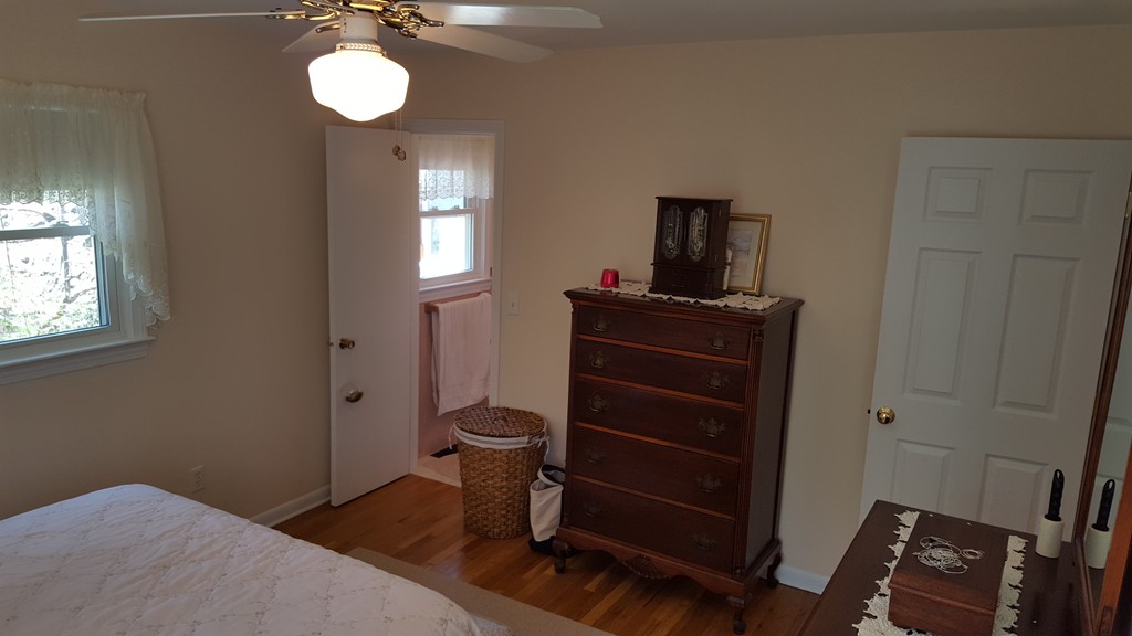 15 Stage Coach Road Boxford, MA 01921 - Photo 18 of 29 a bedroom with a bed and a window