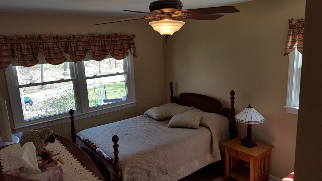 15 Stage Coach Road Boxford, MA 01921 - Photo 20 of 29 a bedroom with a bed and a window