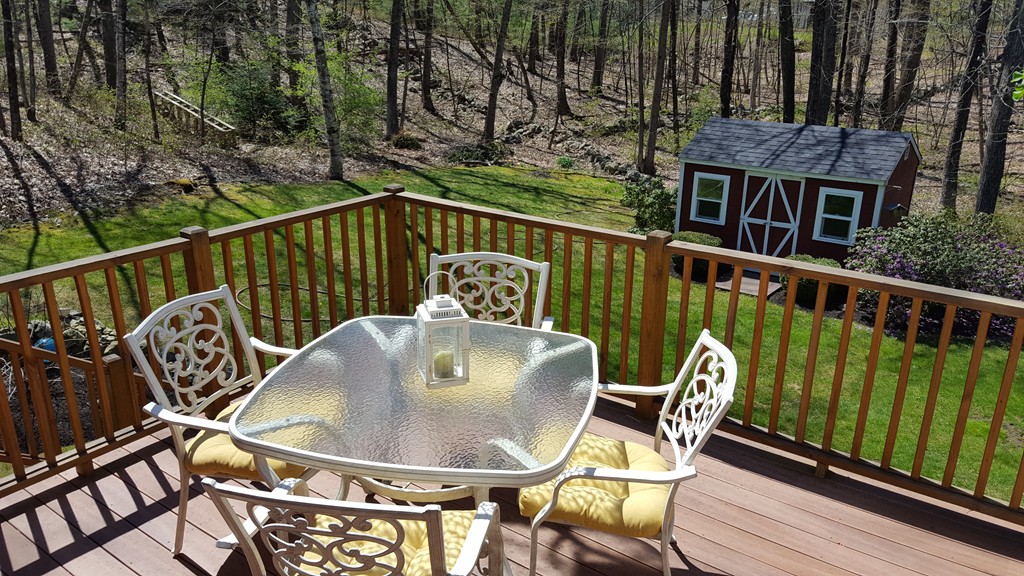 15 Stage Coach Road Boxford, MA 01921 - Photo 25 of 29 a balcony with table and chairs