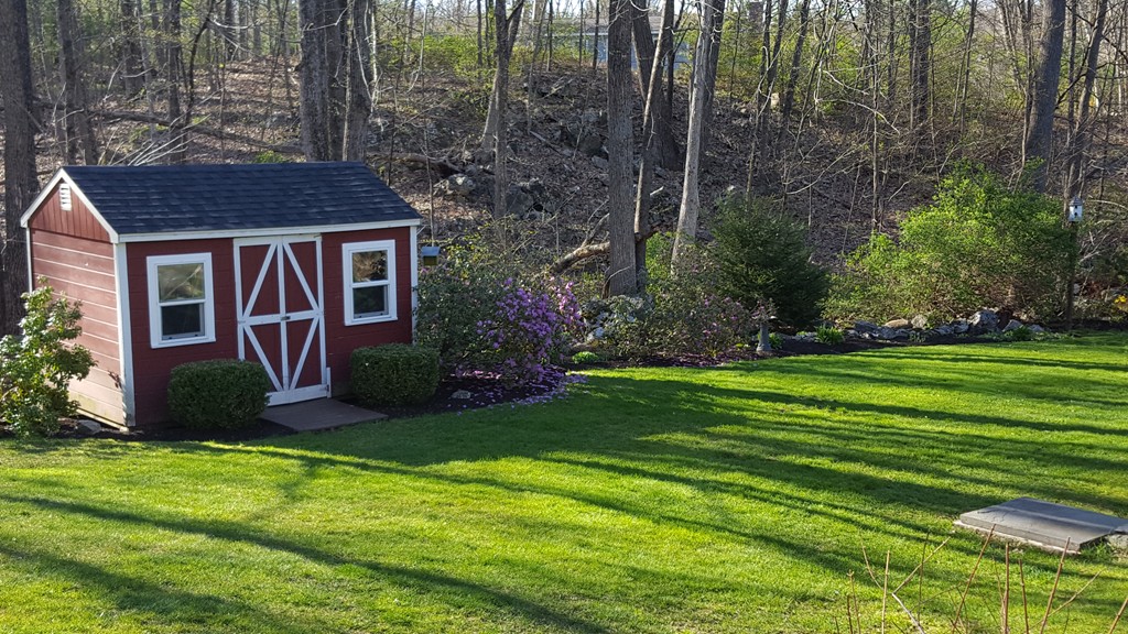 15 Stage Coach Road Boxford, MA 01921 - Photo 26 of 29 a view of a house with backyard and garden