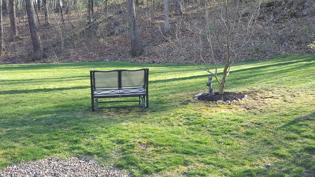 15 Stage Coach Road Boxford, MA 01921 - Photo 27 of 29 a backyard of a house with a yard and outdoor seating