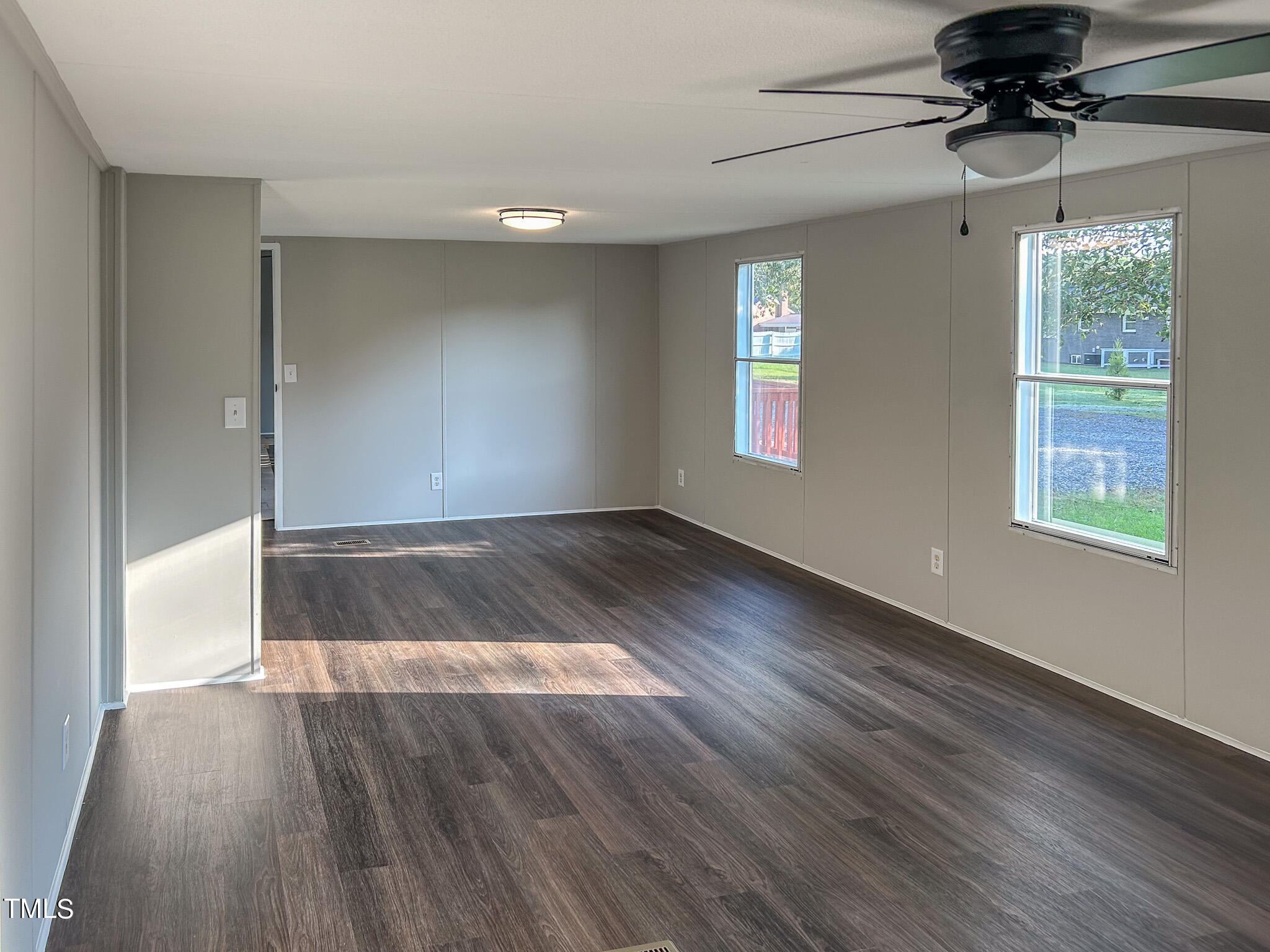 991 Country Club Road Roxboro, NC 27574 - Photo 3 of 11 wooden floor in an empty room with a window
