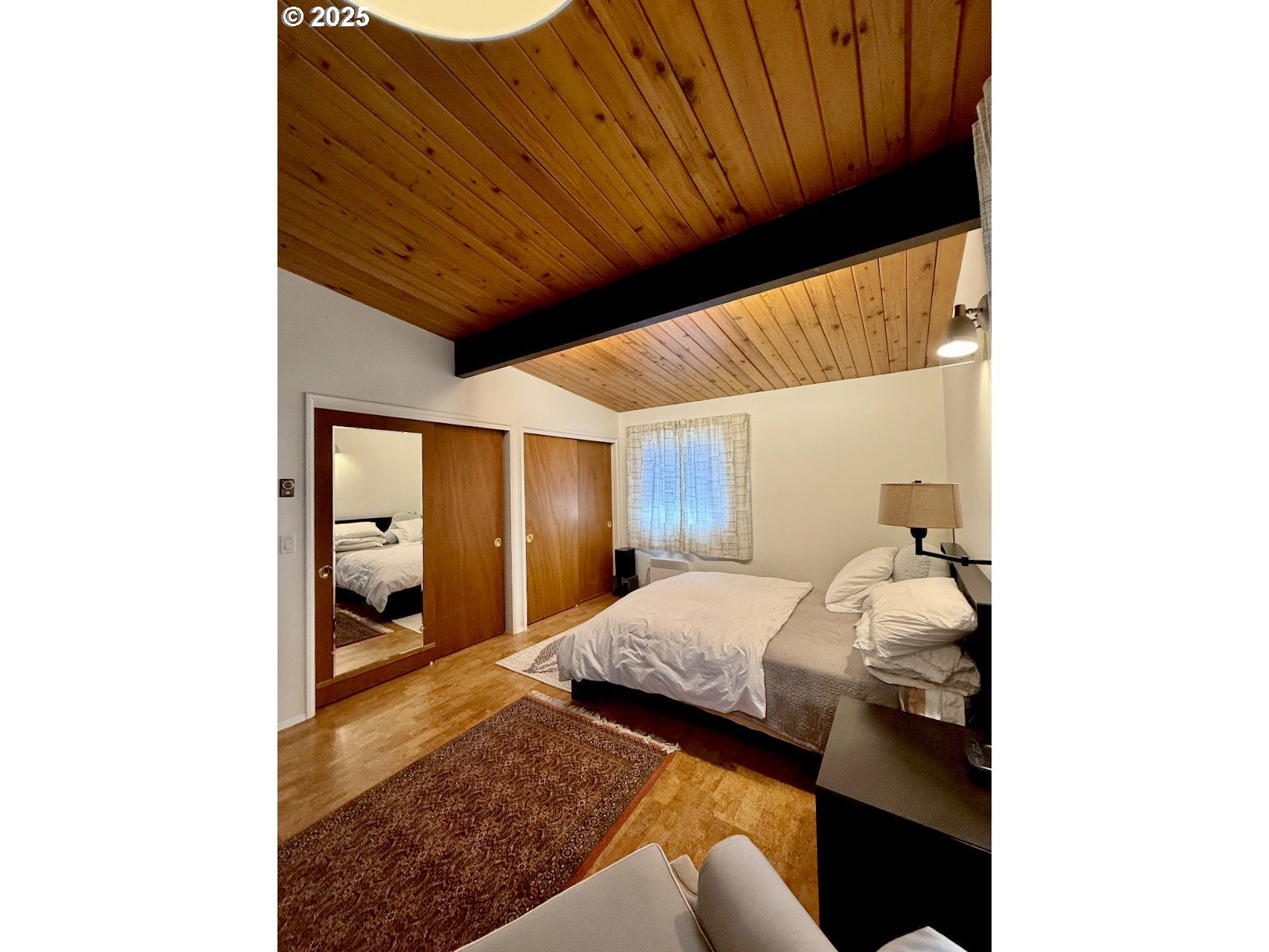 2203 Lorane Highway Eugene, OR 97405 - Photo 22 of 46 a bedroom with a bed and a mirror