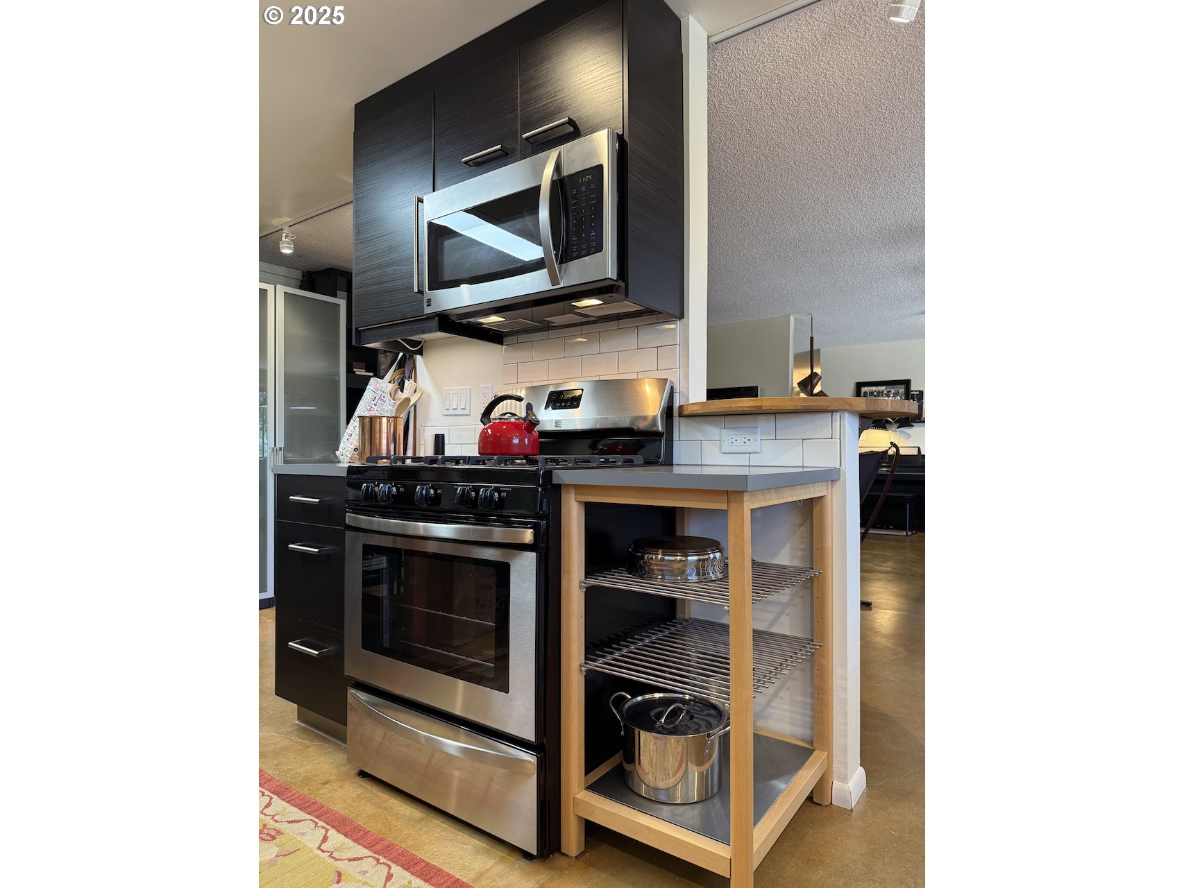 2203 Lorane Highway Eugene, OR 97405 - Photo 32 of 46 a kitchen with a stove and a microwave
