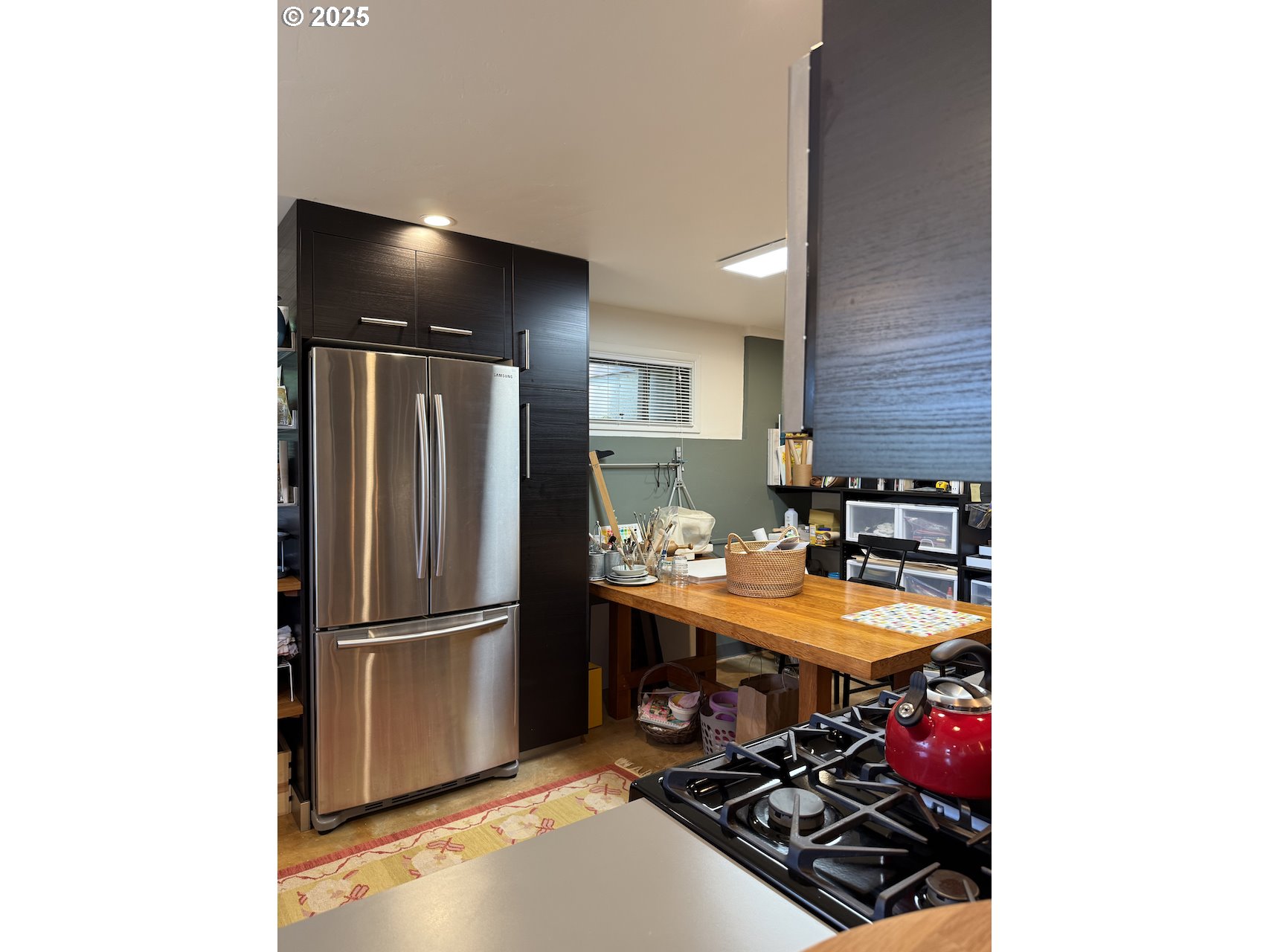 2203 Lorane Highway Eugene, OR 97405 - Photo 34 of 46 a kitchen with a refrigerator and a stove top open