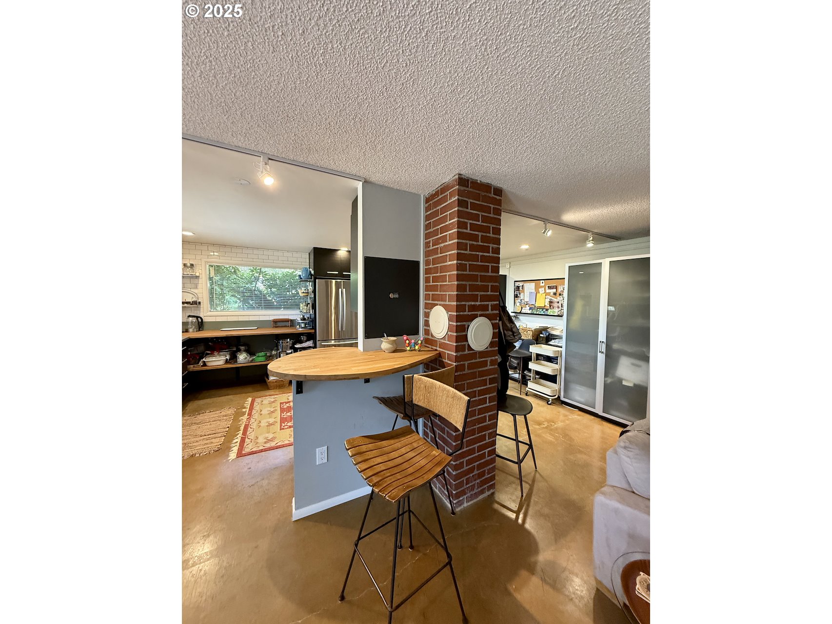 2203 Lorane Highway Eugene, OR 97405 - Photo 36 of 46 a living room with furniture and a floor to ceiling window