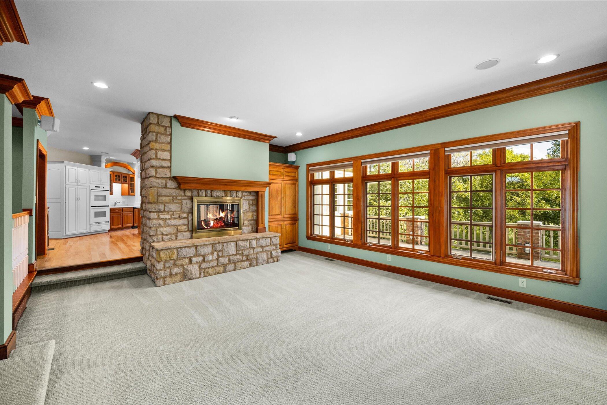 18261 Boerger Road Marysville, OH 43040 - Photo 15 of 94 Great Room with Crown molding and beautiful wood trim and windows - stone 2-sided Fireplace shared with Kitchen