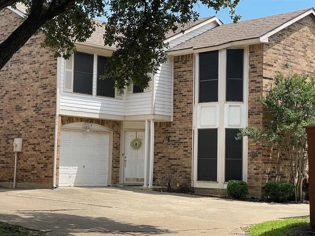 a front view of a house with garage