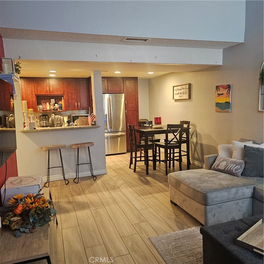 435 West 9th, Unit B3 Upland, CA 91786 - Photo 16 of 71 a living room with furniture and wooden floor