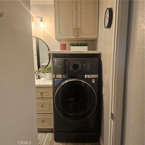 a white toilet sitting next to a bathroom sink