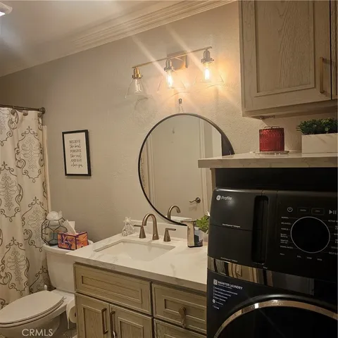 a view of a living room with furniture and a flat screen tv