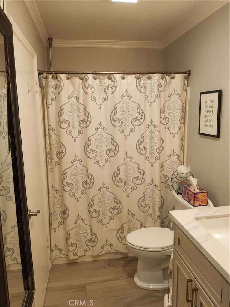 435 West 9th, Unit B3 Upland, CA 91786 - Photo 21 of 71 a white toilet sitting next to a bathroom sink