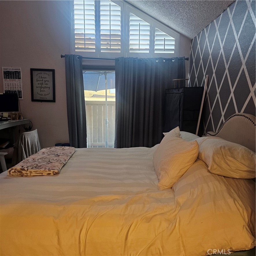 435 West 9th, Unit B3 Upland, CA 91786 - Photo 24 of 71 a bedroom with a bed and a window