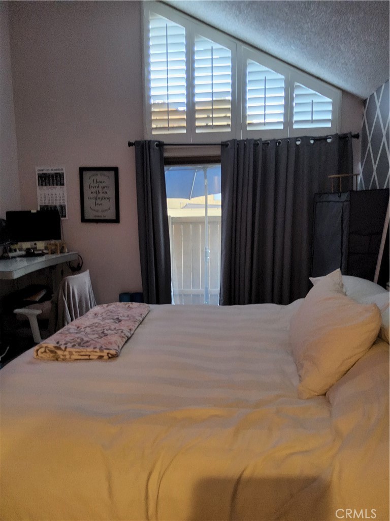 435 West 9th, Unit B3 Upland, CA 91786 - Photo 25 of 71 a bedroom with a bed and a window