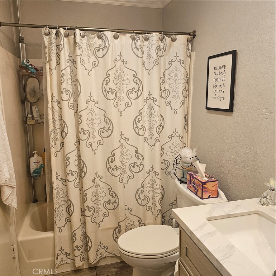 435 West 9th, Unit B3 Upland, CA 91786 - Photo 28 of 71 a white toilet sitting next to a bathroom sink