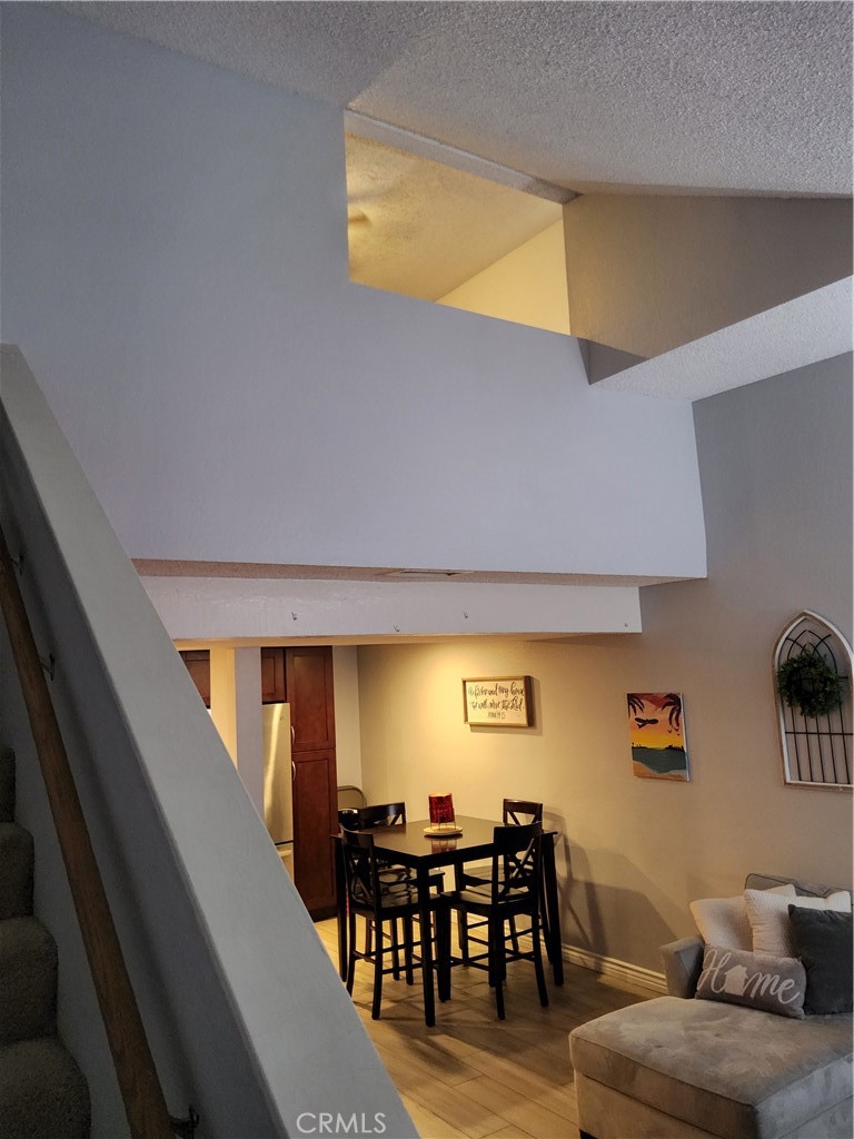 435 West 9th, Unit B3 Upland, CA 91786 - Photo 30 of 71 a dining room with furniture and wooden floor