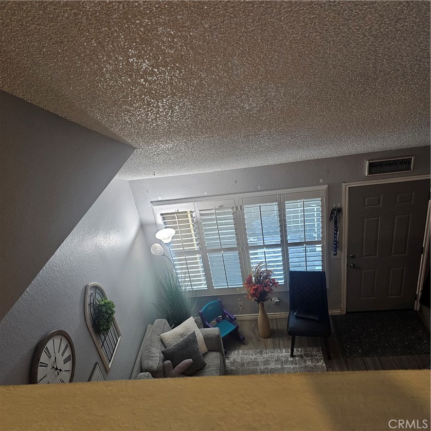 435 West 9th, Unit B3 Upland, CA 91786 - Photo 33 of 71 a living room with furniture and large windows