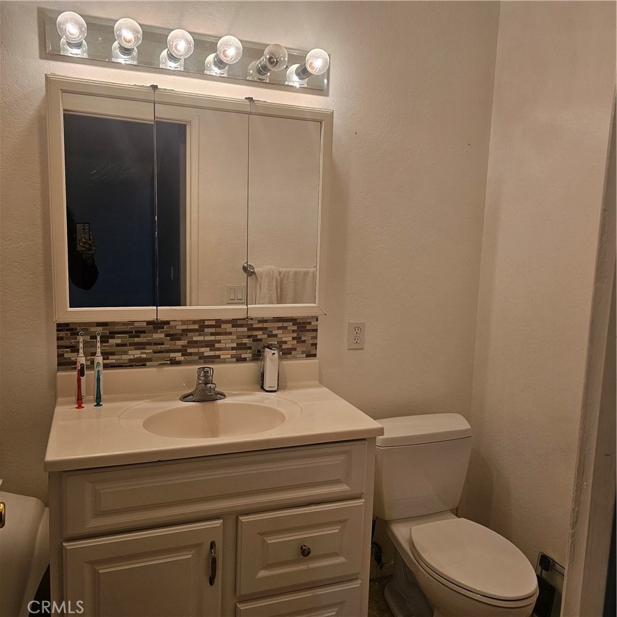 435 West 9th, Unit B3 Upland, CA 91786 - Photo 38 of 71 a bathroom with a sink and a toilet