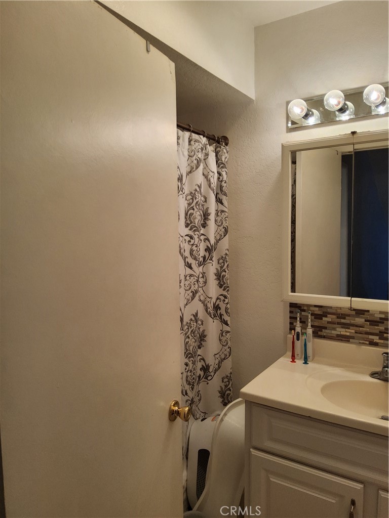 435 West 9th, Unit B3 Upland, CA 91786 - Photo 39 of 71 a bathroom with a sink a toilet and shower