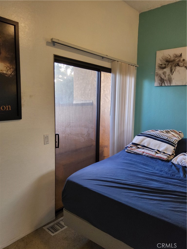 435 West 9th, Unit B3 Upland, CA 91786 - Photo 43 of 71 a bedroom with a bed and a flat screen tv