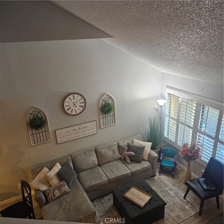 435 West 9th, Unit B3 Upland, CA 91786 - Photo 47 of 71 a living room with furniture and a window