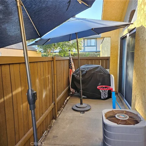 a living room with furniture a window and kitchen view