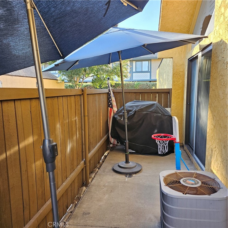 435 West 9th, Unit B3 Upland, CA 91786 - Photo 5 of 71 a room with water heater and a wooden floor