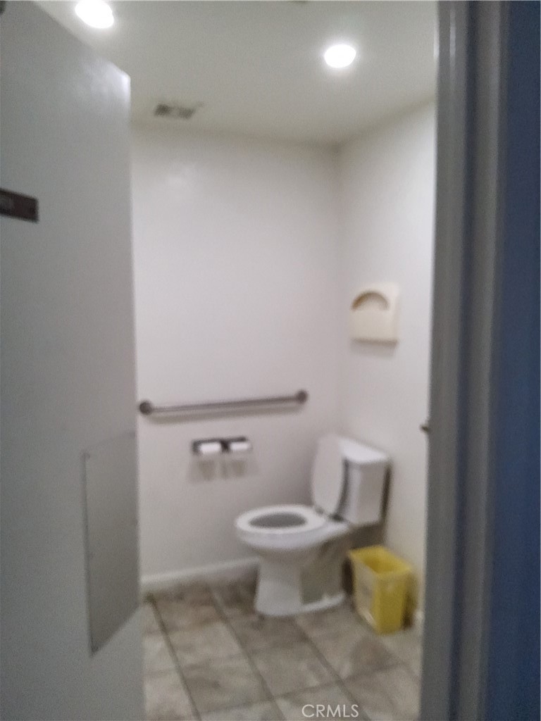 435 West 9th, Unit B3 Upland, CA 91786 - Photo 61 of 71 a white toilet sitting next to a bathroom sink